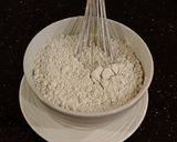 A picture of step 7 of Cinnamon Layer Cake with Whipped Cinnamon Cream Filling and Frosting.