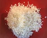 A picture of step 1 of Steamed Mochi Rice Dumplings with Pork and Bamboo Shoots in a Frying Pan.
