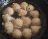 A picture of step 11 of Mysore Bonda and Ulundu bonda with Rasam.