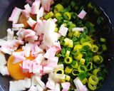 A picture of step 1 of Bento-Style Tamagoyaki with Green Onions and Fish Cake.