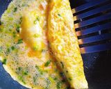 A picture of step 4 of Bento-Style Tamagoyaki with Green Onions and Fish Cake.