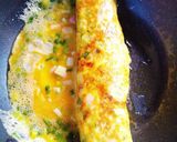 A picture of step 5 of Bento-Style Tamagoyaki with Green Onions and Fish Cake.