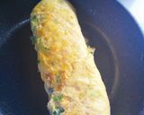 A picture of step 6 of Bento-Style Tamagoyaki with Green Onions and Fish Cake.