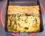 A picture of step 2 of Tamagoyaki with Shio Kombu and Green Onion.