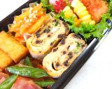 A picture of step 5 of Tamagoyaki with Shio Kombu and Green Onion.