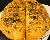 A picture of step 9 of Dominos Style Stuffed Cheesy Garlic Bread.