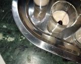 A picture of step 4 of Orange lemon posset shoters.