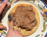 A picture of step 4 of Smashed Beef Pita with Tzatziki & Sumac Salad.