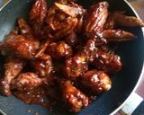 A picture of step 5 of Sticky orange wings.