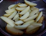 A picture of step 2 of Garlic Potato Wedges.