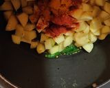 A picture of step 2 of Aloo tamatar tangy curry.