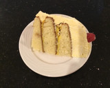 A picture of step 17 of Vanilla Layer Cake filled withLenon and Rasberry and frosted with Fresh Lemon Cream.