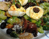 A picture of step 13 of Buttery broccoli salad topped with deviled eggs.