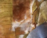 A picture of step 3 of Elai Adai (rice sweet in banana leaf).