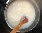 A picture of step 3 of Let's bond over cucumber salad and egg congee.