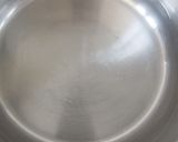 A picture of step 1 of Red Tea with Milk, Cloves, and Cardamom.
