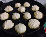 A picture of step 2 of Dahi vada in Appe pan.