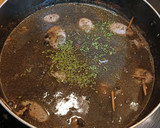 Foto del paso 9 de la receta: Chipirones en su tinta rellenos de langostinos