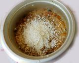 A picture of step 4 of Spicy, cheesy Tomato, mushroom noodle soup.