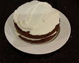 A picture of step 17 of Mocha Layer Cake with Whipped Mascarpone Cream and a Coffee Glaze Drizzle.