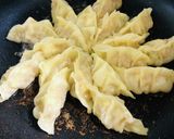 A picture of step 7 of How to Pan-Fry Gyoza (Homemade or Frozen) Perfectly.