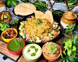 A picture of step 6 of Uttar Pradesh Urad Daal Aur Naye Chawal ki Khichdi Aloo Bharte Aur Hari Chutney (dinner or lunch).