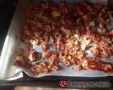 A picture of step 5 of Kalamarakia in the oven as if fried.