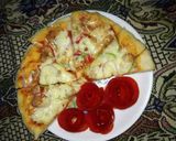 A picture of step 10 of Chicken fajita pizza.