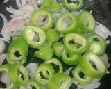 A picture of step 4 of Onion and bitter gourd karela sabji.