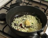A picture of step 2 of Mix veg with mango purée and coconut milk.