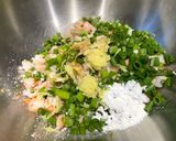 A picture of step 2 of Ebi Nira Harumaki - prawn and garlic chive rice paper packets.