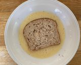 A picture of step 2 of Eggy bread with strawberries and maple syrup.
