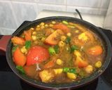 A picture of step 3 of Chickpea And Tomato In Turmeric Sauce.