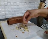 A picture of step 10 of Biscuits Meethi (Swiss roll style).
