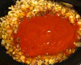 A picture of step 3 of Rui Macher Jhaal (Rohu Fish Curry).