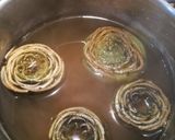Foto del passaggio 1 della ricetta Carciofi ripieni con la salsiccia
