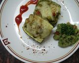 A picture of step 8 of Zucchini stuffed with cheesy Guacamole.