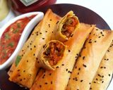 A picture of step 16 of Crunchy chicken filo cigars.