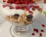 A picture of step 2 of Super healthy breakfast bowl topped with pomegranate seeds.