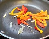 A picture of step 2 of Stir-Fried Pork Stomach with Asparagus and Sweet Peppers.