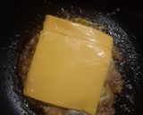 A picture of step 4 of 15 Cent Diner Fried Egg Sandwich with cheese.