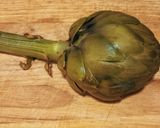 A picture of step 3 of Grilled Artichokes with Garlic, Oil, and Parsley Dressing.