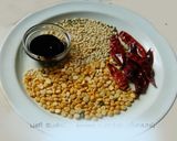 A picture of step 1 of Drum stick tomato masala curry (sambar) mixed with rice.