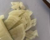 A picture of step 5 of Anti Vampire Cheese Sauce, with Onions and Garlic.