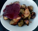 A picture of step 4 of My Roasted Sprouts in orange,crushed Walnuts and Cranberry sauce.