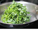 A picture of step 3 of Pulicha keerai koottu (Paruppu keerai in Tamil, Kulfa Ka Saag in Hindi, Purslane in English).