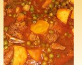 A picture of step 7 of Beef stew with potatoes and green peas.