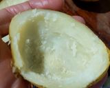 A picture of step 4 of "loaded" stuffed potato skins.