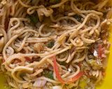 A picture of step 1 of Left over chowmien wrapped with torn Manda patti strips.