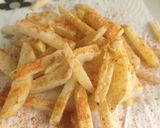 A picture of step 4 of Peri peri French fries.
